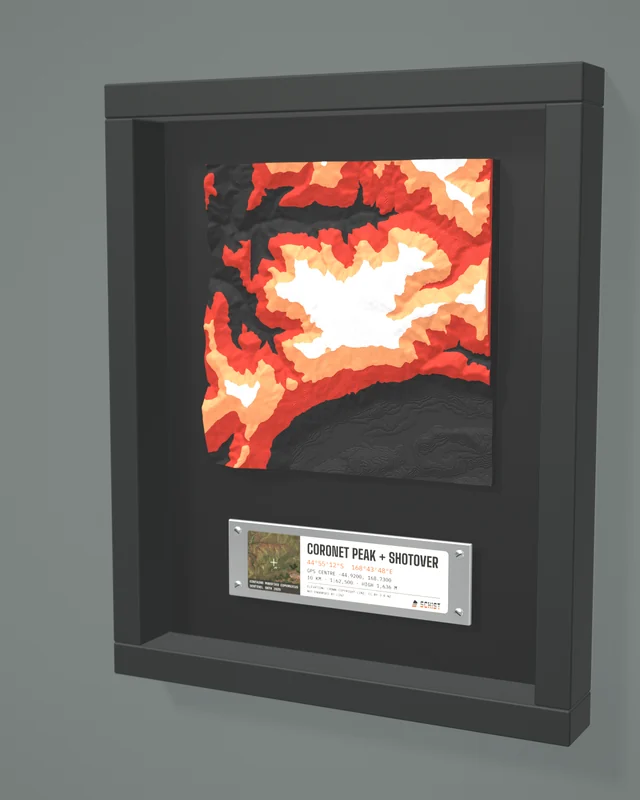 Render: the Coronet Peak + Shotover tile in a dark shadow-box frame with a coordinate plate below it