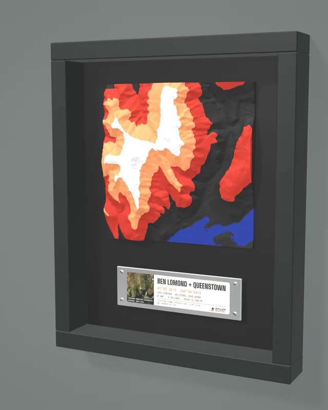 Render: the Ben Lomond + Queenstown tile in a dark shadow-box frame with a coordinate plate below it