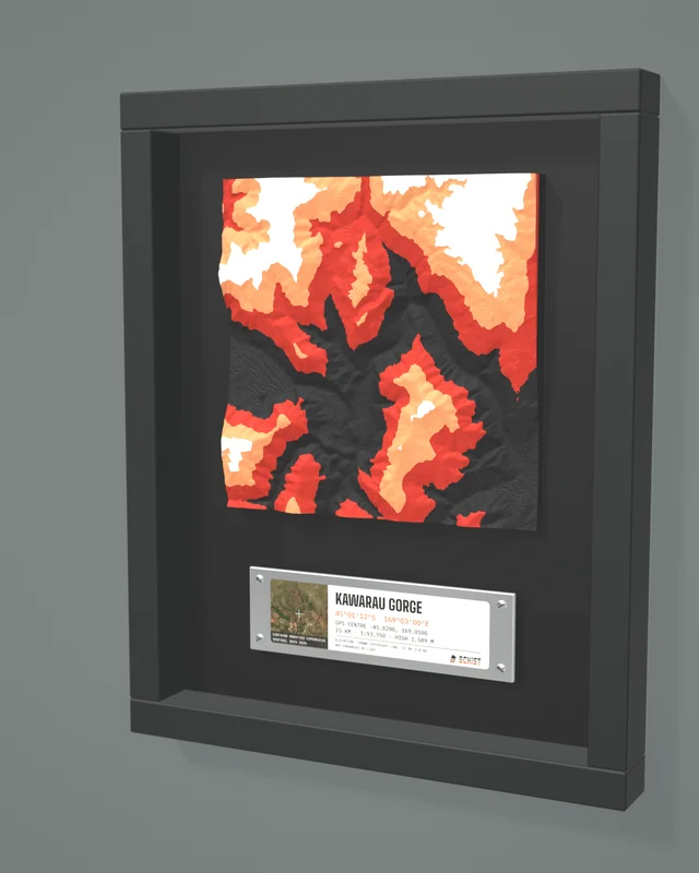 Render: the Kawarau Gorge tile in a dark shadow-box frame with a coordinate plate below it